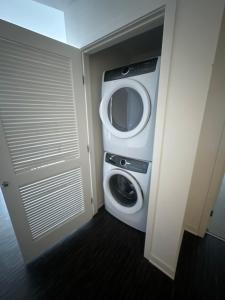 a washer and dryer in a small room at Amazing 2BD2BA located DTLA in Los Angeles