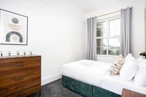 a bedroom with a bed and a window at Mulberry View by Sorted Stay in Southend-on-Sea