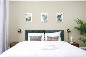 a bedroom with a large white bed with pillows at Mulberry View by Sorted Stay in Southend-on-Sea