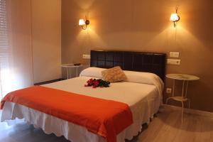Postel nebo postele na pokoji v ubytování Hotel Ronsel