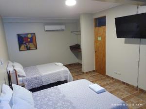 Cama ou camas em um quarto em Hotel El Huacachinero