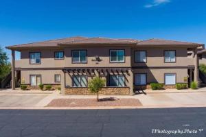 a large apartment building on a street at Golfers Getaway - Mesquite in Mesquite