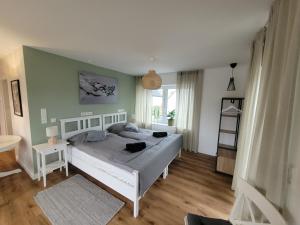 a bedroom with a large bed in a room at Ferienwohnung Nachtigall 2 in Bad Hersfeld