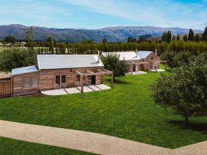 a large yard with two barns and a house at Monte Christo Winery Cottages in Clyde