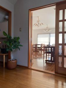 a mirror in a living room with a dining room at Ryokankasuga - Vacation STAY 90832v in Nabari