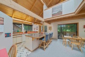 a kitchen and dining room with a table and chairs at Sea Dream MCA#398 in Manzanita
