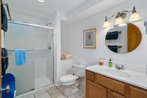 a bathroom with a shower and a toilet and a sink at Neahkahnie MCA#50060 in Manzanita +26 photos