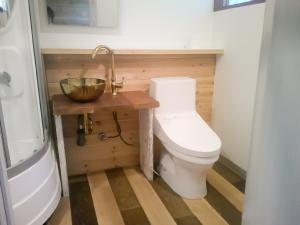 a bathroom with a toilet and a bowl on a table at Futtsu Sea House INN Kanaya - Vacation STAY 95628v in Futtsu