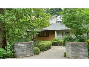 a house with two retaining walls in front of it at Oyado Kotobuki - Vacation STAY 97600v in Yokokura