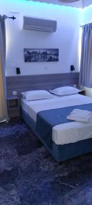 A bed or beds in a room at San Georgio Hotel