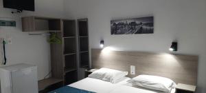 A bed or beds in a room at San Georgio Hotel