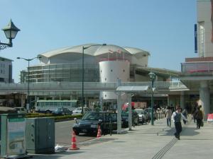 a building with a car parked in a parking lot at Onomichi Daiichi Hotel - Vacation STAY 02582v in Onomichi