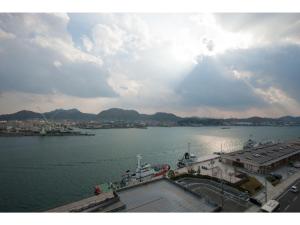 a large body of water with a boat in it at Onomichi Daiichi Hotel - Vacation STAY 02581v in Onomichi