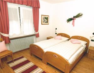 Postel nebo postele na pokoji v ubytování Appartamento Rose Di Bosco