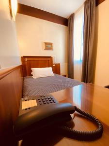 Postel nebo postele na pokoji v ubytování Hotel Bellevue