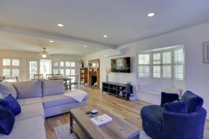 a living room with a couch and chairs and a table at San Diego Home Private Outdoor Pool and Game Room! in San Diego