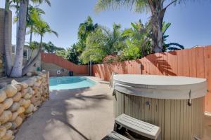 a backyard with a swimming pool and a fence at San Diego Home Private Outdoor Pool and Game Room! in San Diego