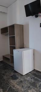 A television and/or entertainment centre at San Georgio Hotel