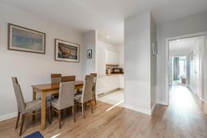 a kitchen and dining room with a table and chairs at Two bed apartment in Sandyford in Sandyford
