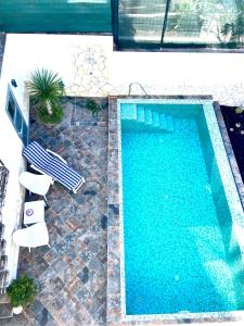 Utsikt över poolen vid Villa Oasis La Paz - Pelinor Studio - ADULTS ONLY eller i närheten
