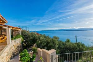 a house with a view of the water at Apartments Eastern Paradise in Bol