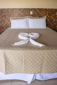 Cama ou camas em um quarto em POUSADA CAJUEIRO
