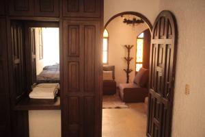 an open door to a room with a bedroom at Casa Fátima in San Cristóbal de Las Casas