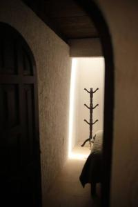 a hallway with a light shining into a room at Casa Fátima in San Cristóbal de Las Casas
