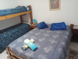 a bedroom with two beds and a bunk bed at LA FATIMA in Gualeguaychú