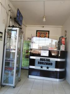 a store with a sign that reads hostel renovated at Hostal Boulevard in Nazca