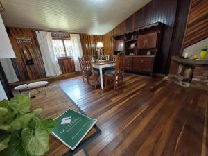 a kitchen and living room with a table and chairs at La esquina in Dos de Mayo +15 photos