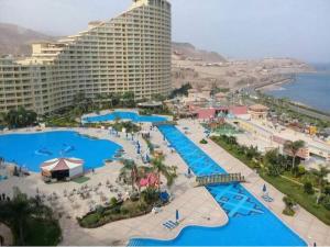 an aerial view of a resort with several pools at Porto sokhna pyramids family only in Ain Sokhna