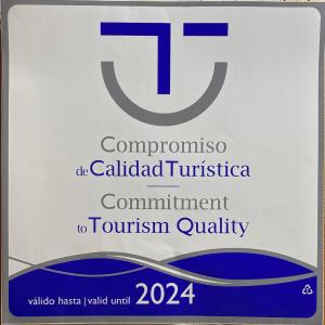a sign that reads tromycin colabidated tuberculosis commitment to tourism quality at La Voz del Silencio in Neril