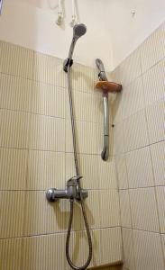 a shower in a bathroom with a tile wall at North Africa Casablanca in Casablanca