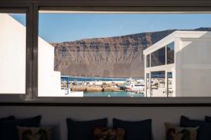 a view of a marina from a window at Delmar La Graciosa in Caleta de Sebo