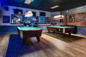 a billiard room with two pool tables in it at Studio 6 Jackson MS I 55 in Jackson