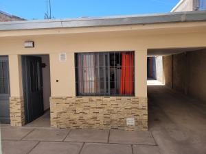a building with a window with bars on it at Departamento San Francisco in Guaymallen