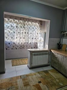 a room with a window with a radiator in it at Квартира в Алматы . 23 in Almaty