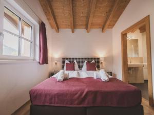 Łóżko lub łóżka w pokoju w obiekcie Chalet Anna Leogang