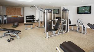 a gym with several treadmills and machines at Apartment with Panoramic Views & Free parking! in Los Angeles