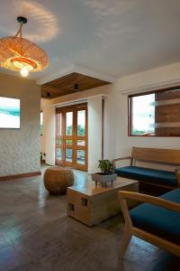 a living room with a couch and a table at Cannatel Exclusive Hotel in La Tebaida