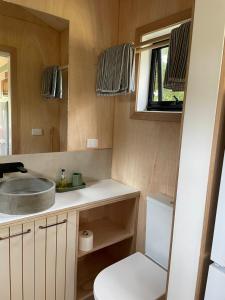 a small bathroom with a sink and a toilet at Marlo Hideaway in Marlo