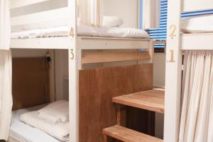 Ένα ή περισσότερα κρεβάτια σε δωμάτιο στο hostel Ini kobe l Self Cozy Stay +29 φωτογραφίες