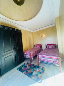 Ένα ή περισσότερα κρεβάτια σε δωμάτιο στο Appartement vue sur mer