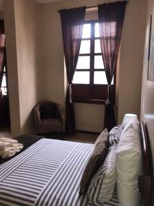 En eller flere senger på et rom på HOTEL en el CENTRO HISTORICO