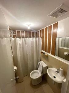 Koupelna v ubytování UDHH Ostentation Homes Stay + 3 fotografie