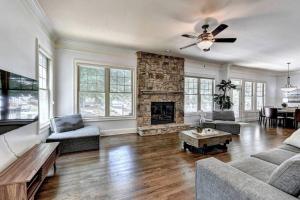 a living room with a couch and a fireplace at Stunning Southern Experience in Atlanta