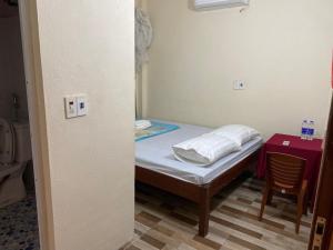 Cama o camas de una habitación en Hồng Gấm Homestay