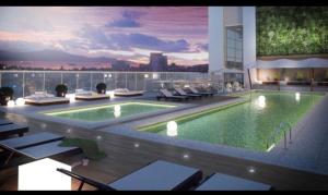 a swimming pool on top of a building at Residencial Legend in Santos