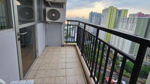a balcony with a view of a city at Amazing view Apartment at Kemayoran JIEXPO -Min Stay 3 nights- in Jakarta